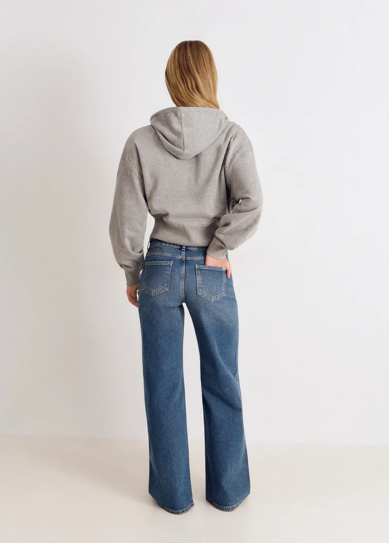 Embroidered front-pocket jeans