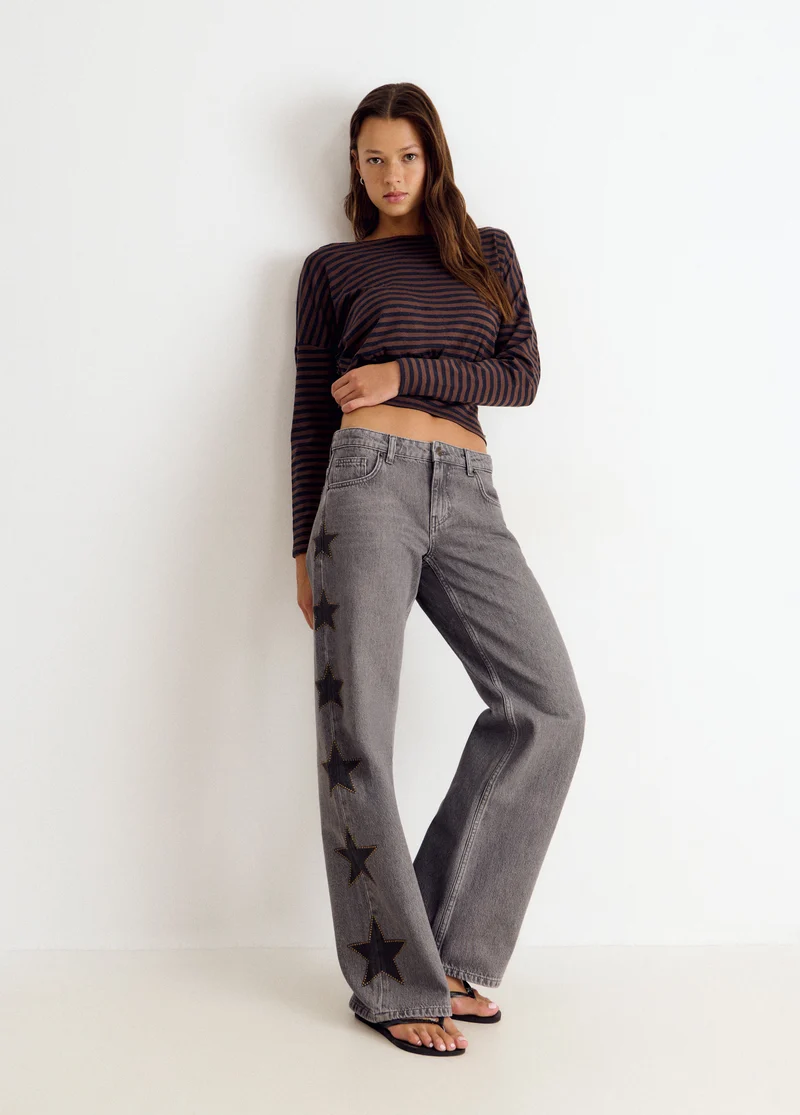 Jeans with stars and side studs