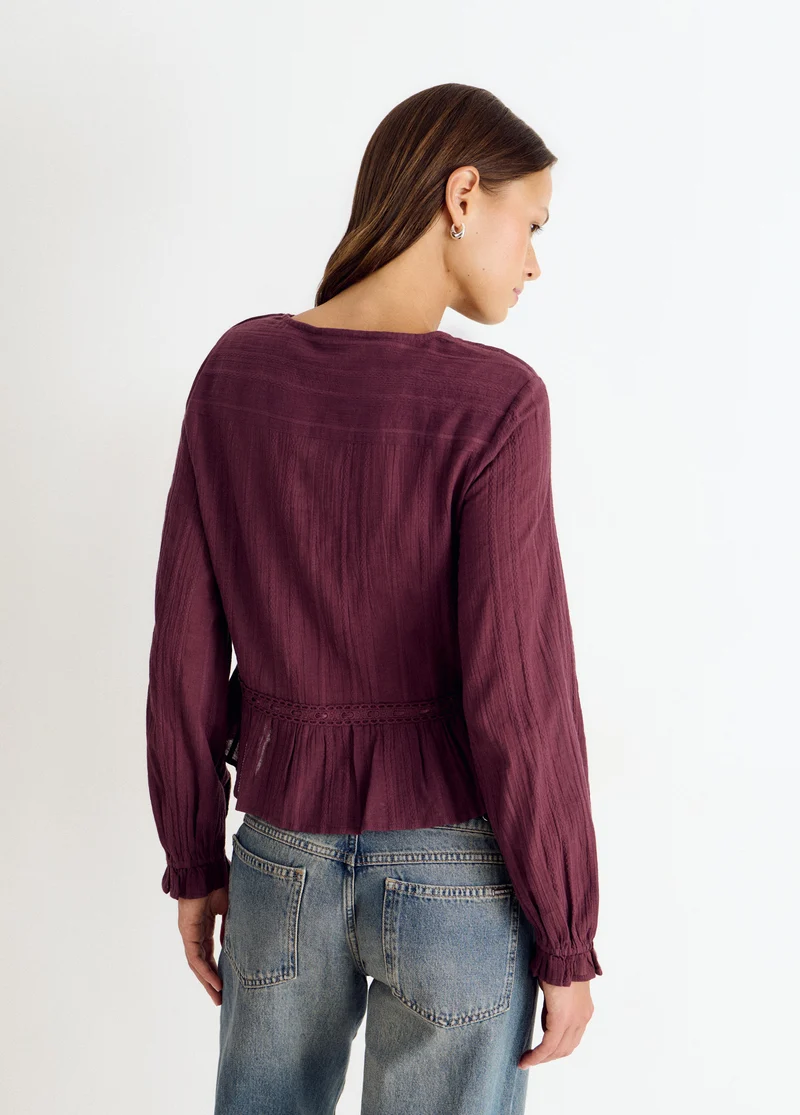 Long-sleeved ruffle blouse
