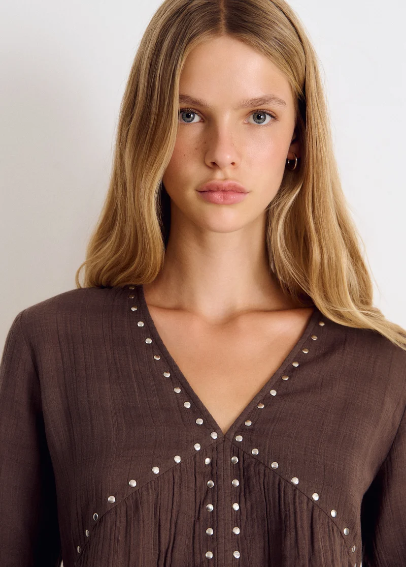 Long-sleeve studded V-neck blouse