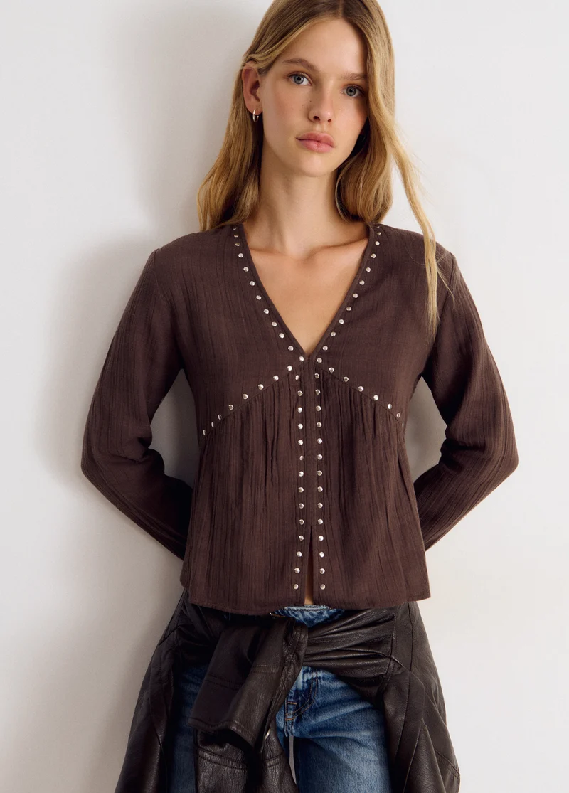 Long-sleeve studded V-neck blouse