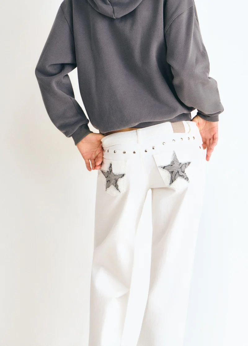 Low-rise pants with glitter stars and studs