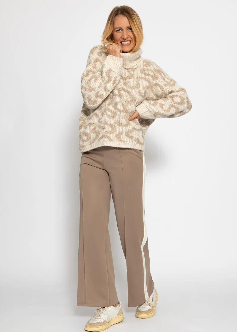 Rollkragenpullover mit Leomuster - beige